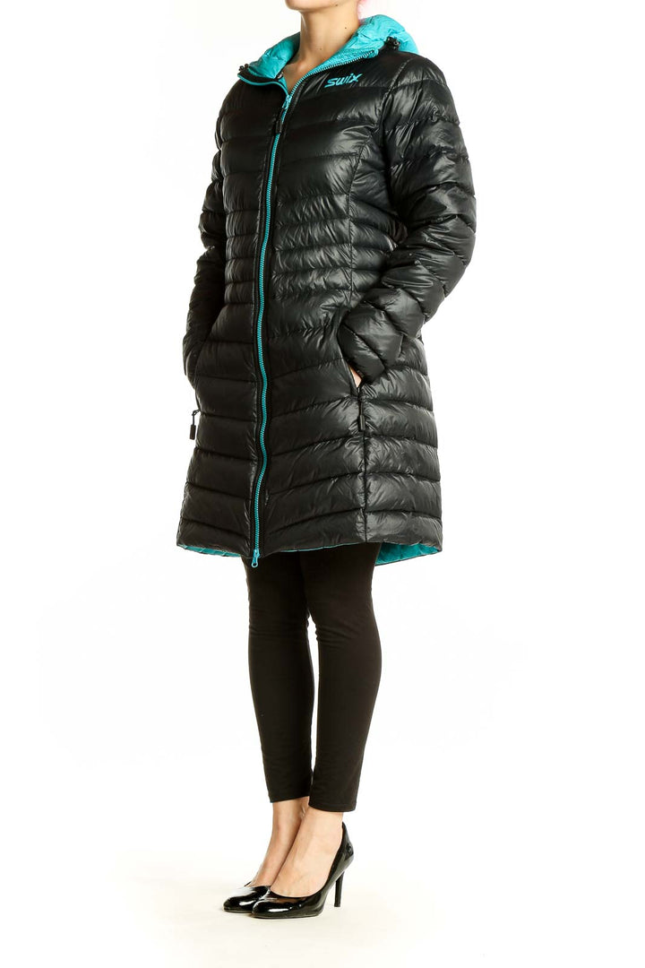 Front view of black Swix long puffer jacket with turquoise zipper