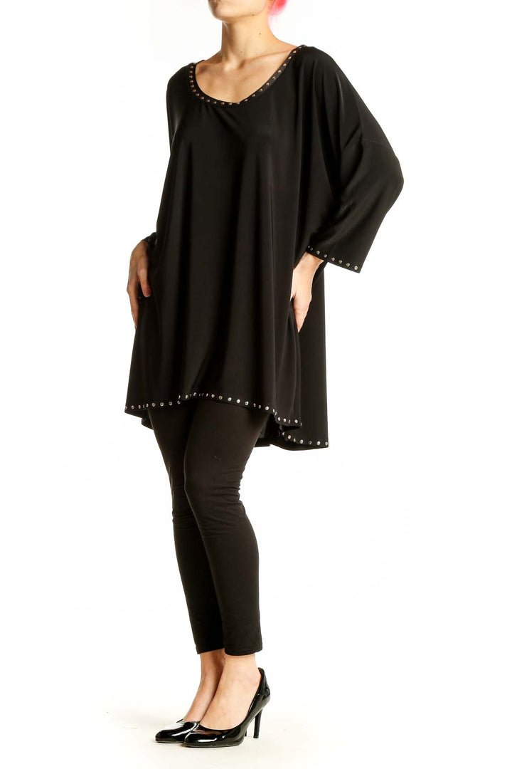 Front view of Isabella Rodriguez black oversized tunic top with studded trim