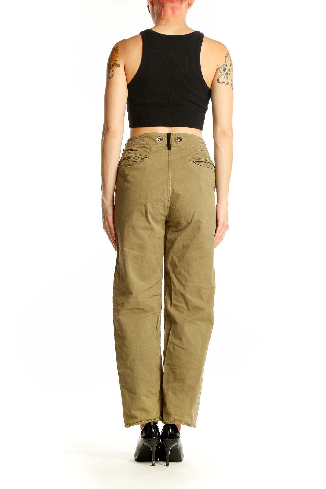 Side view of woman wearing Rag & Bone olive high-waisted pants with black crop top