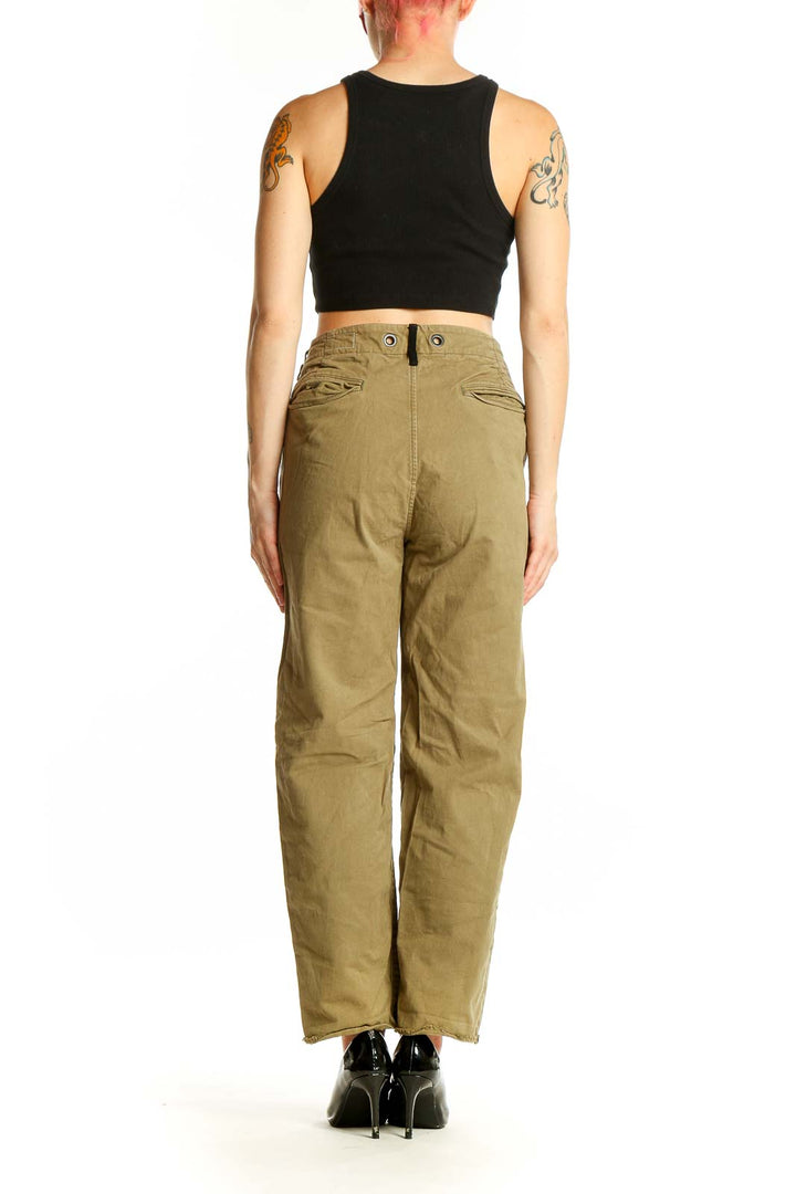 Side view of woman wearing Rag & Bone olive high-waisted pants with black crop top