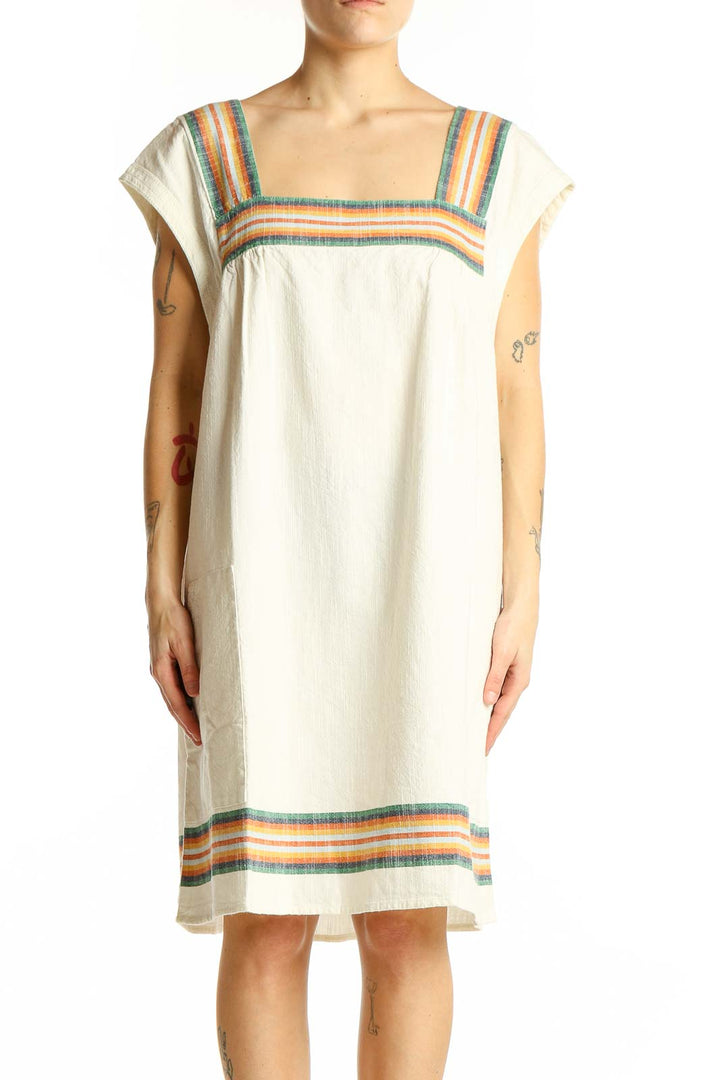 Front view of Faherty cream organic cotton dress with colorful stripes
