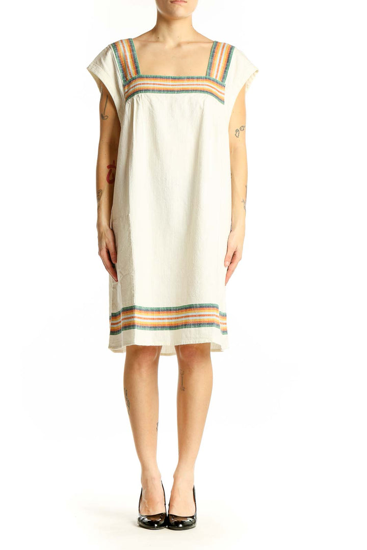 Front view of Faherty cream organic cotton dress with colorful stripes