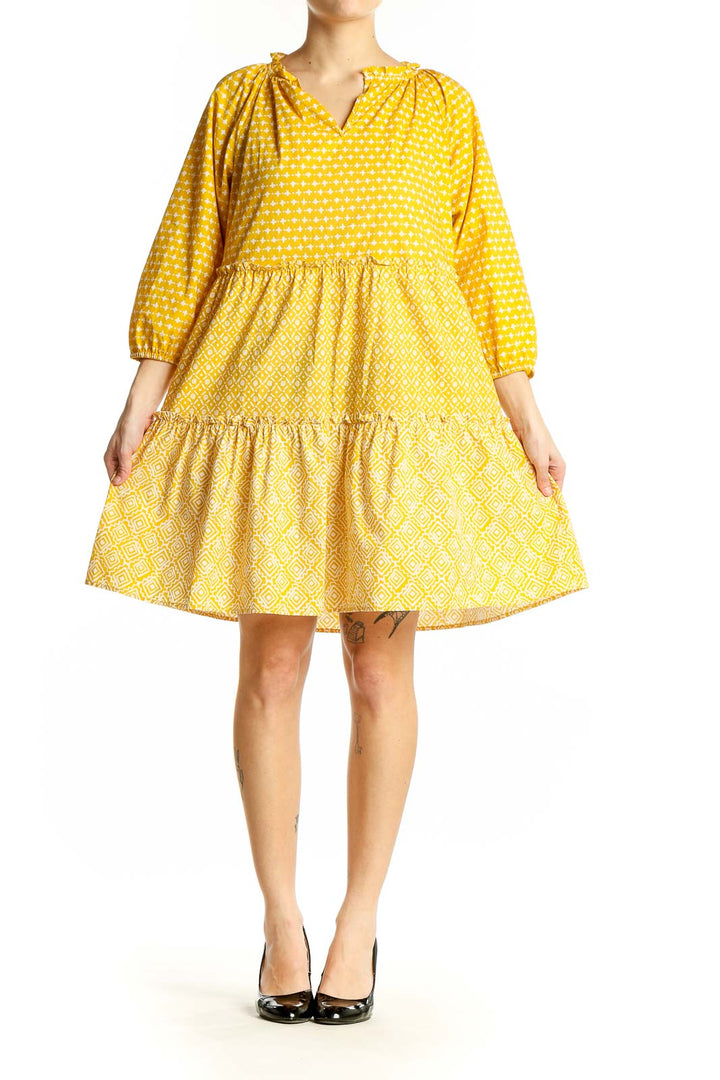 Front view of LOFT yellow polka dot tiered cotton dress with tie neckline