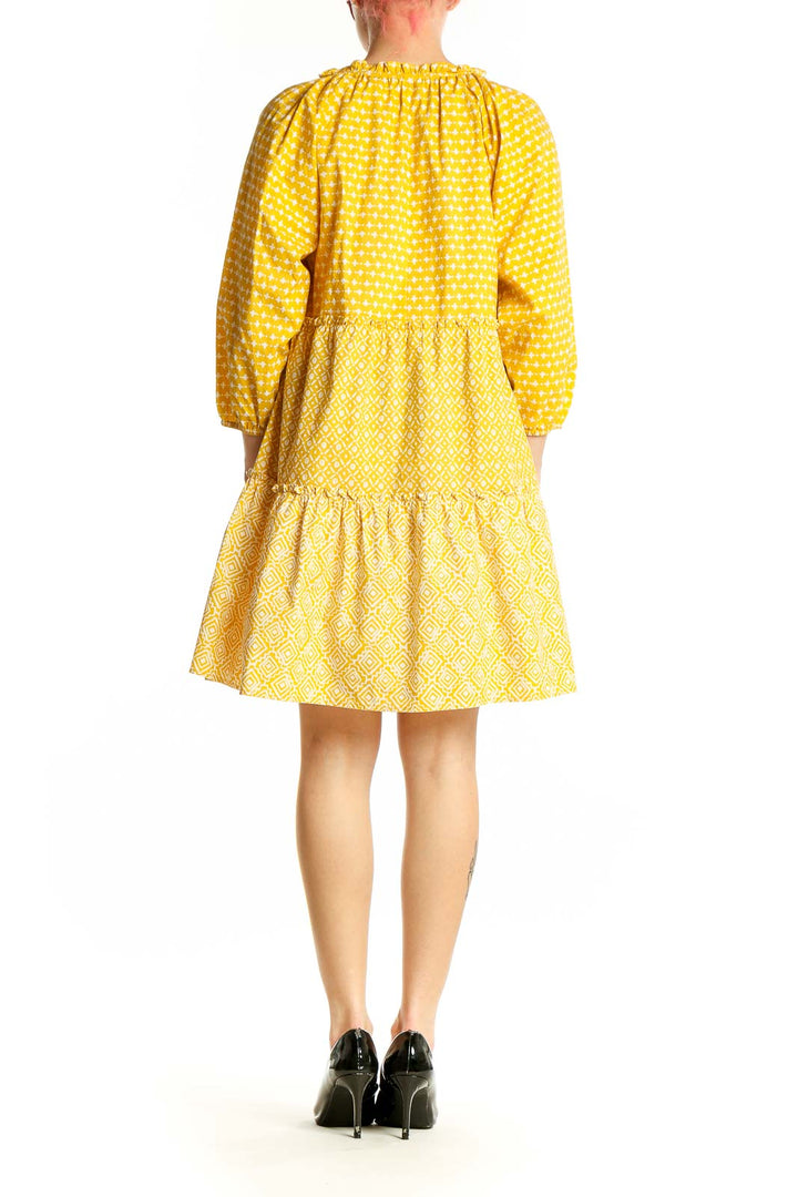 Side view of LOFT yellow polka dot tiered cotton dress showing full silhouette