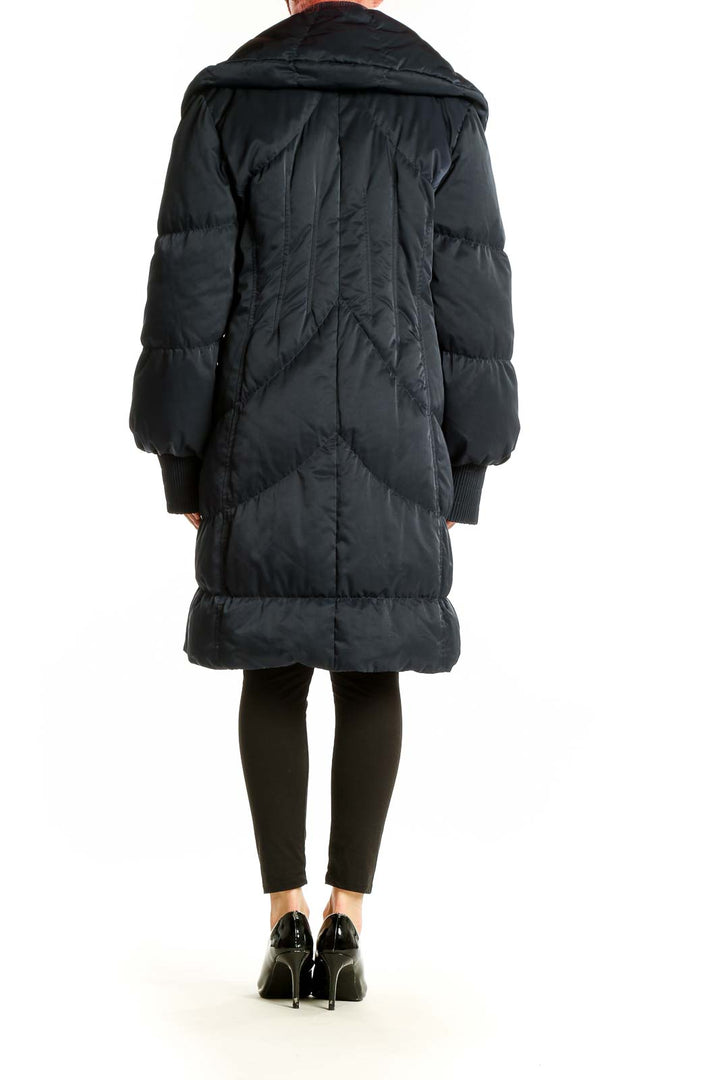 Back view of Elie Tahari navy oversized puffer coat showing length and silhouette