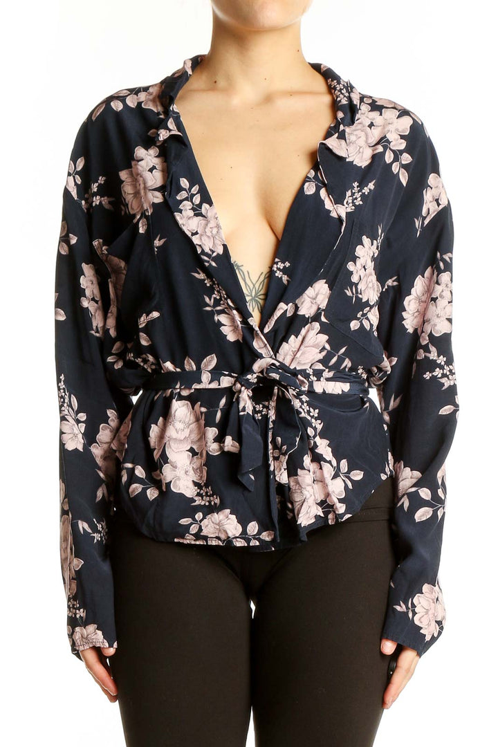 Front view of Marissa Webb navy floral wrap blouse with V-neck and tie-waist