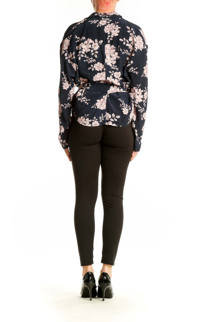 Side view of Marissa Webb navy floral wrap blouse showing drape and fit
