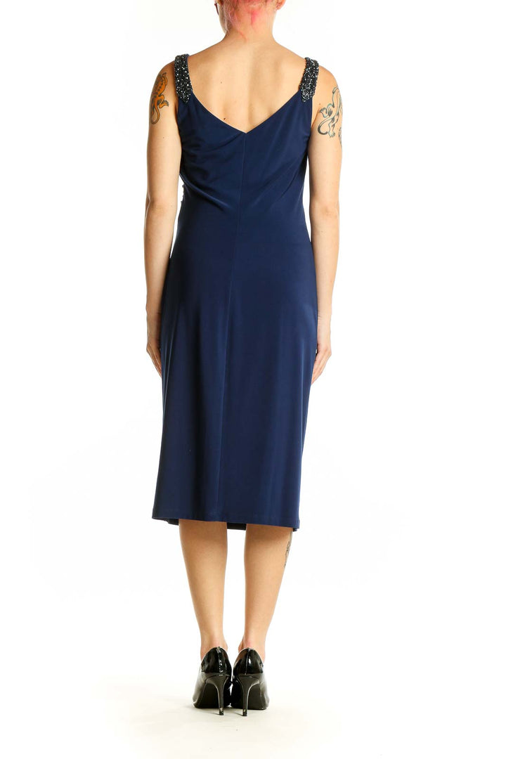 Side view of navy Lauren Ralph Lauren cocktail dress showing ruched silhouette