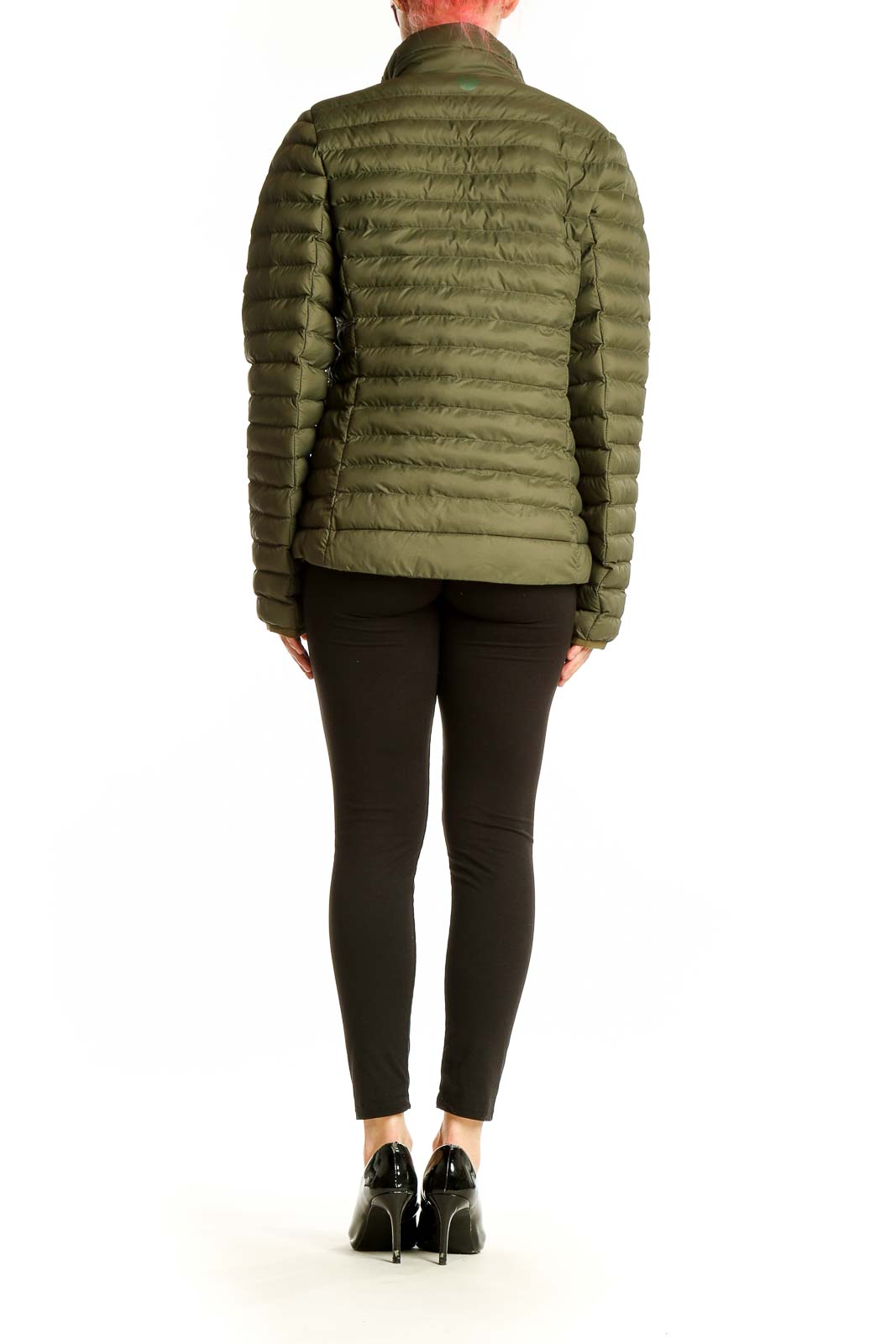 Back view of Marmot olive green quilted puffer jacket on model