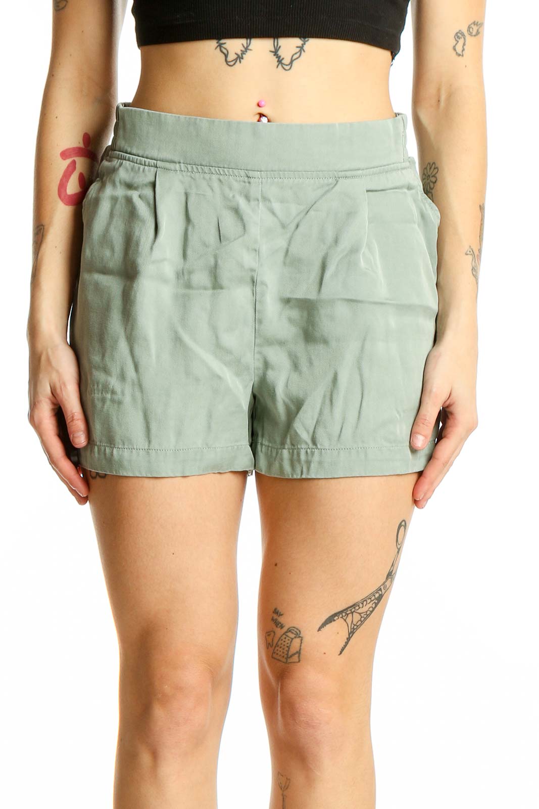 Front view of sage green pleated Lyocell shorts by Threads 4 Thought