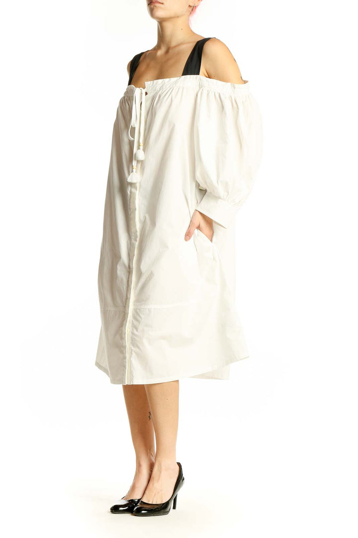 Front view of white off-shoulder cotton midi dress with black straps