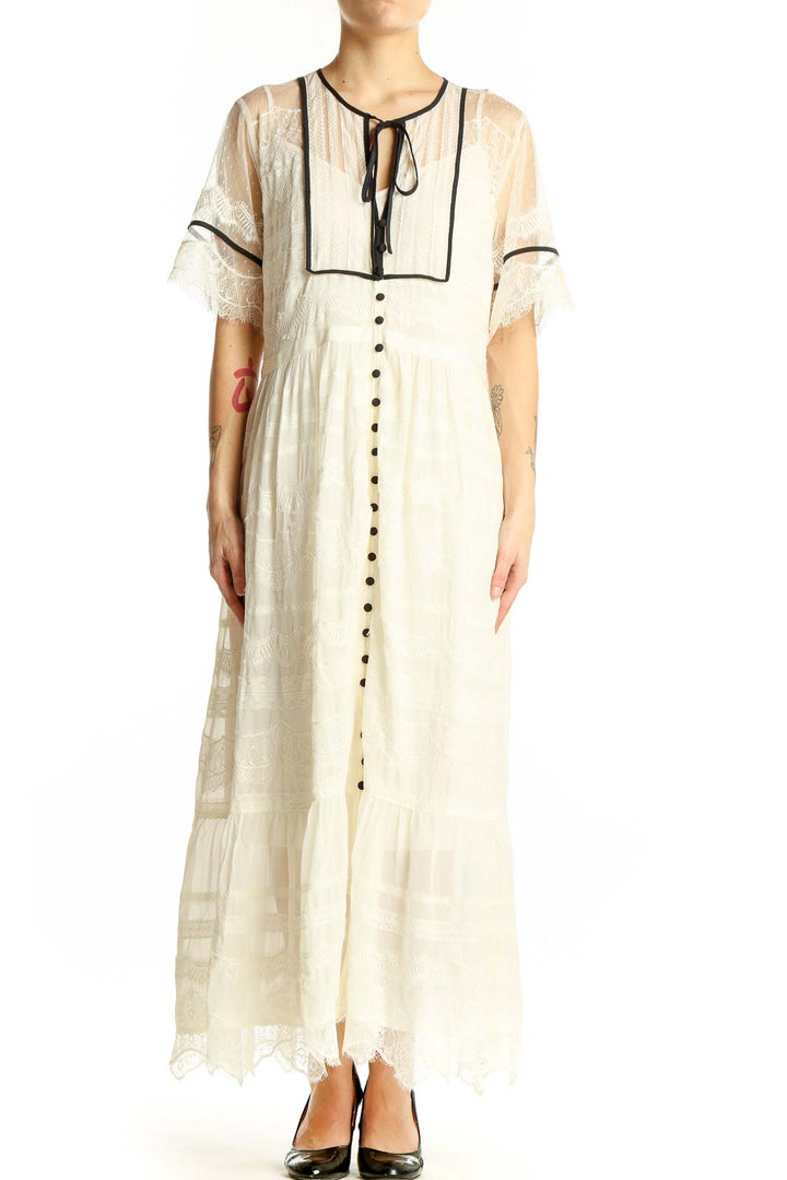 Front view of ivory lace-trimmed maxi dress from Anthropologie