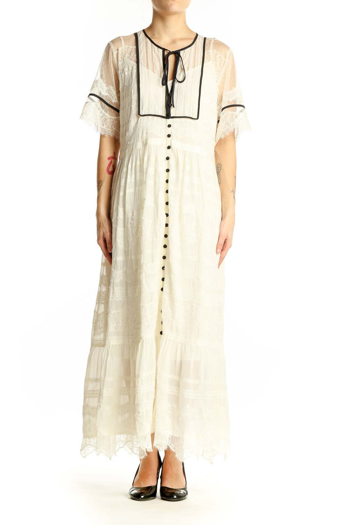 Front view of ivory lace-trimmed maxi dress from Anthropologie