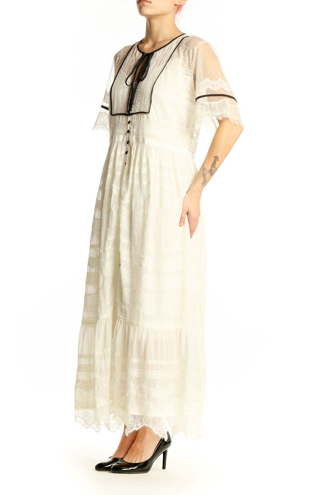 Front view of ivory lace-trimmed maxi dress from Anthropologie