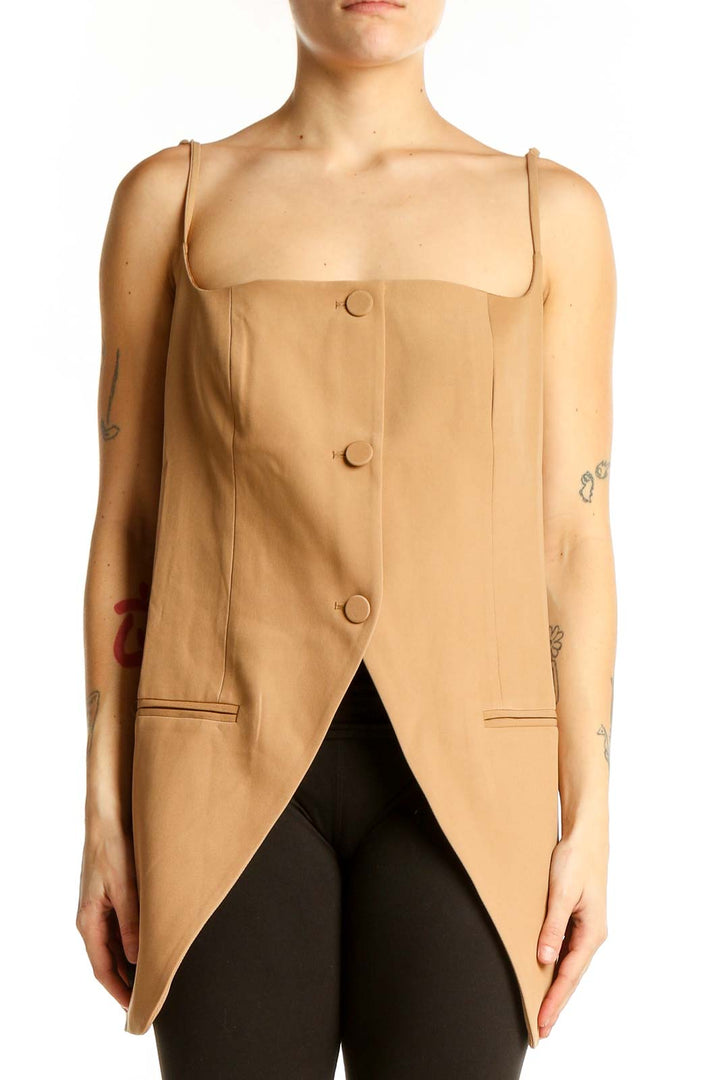 Front view of tan button-front sleeveless top with asymmetrical hemline