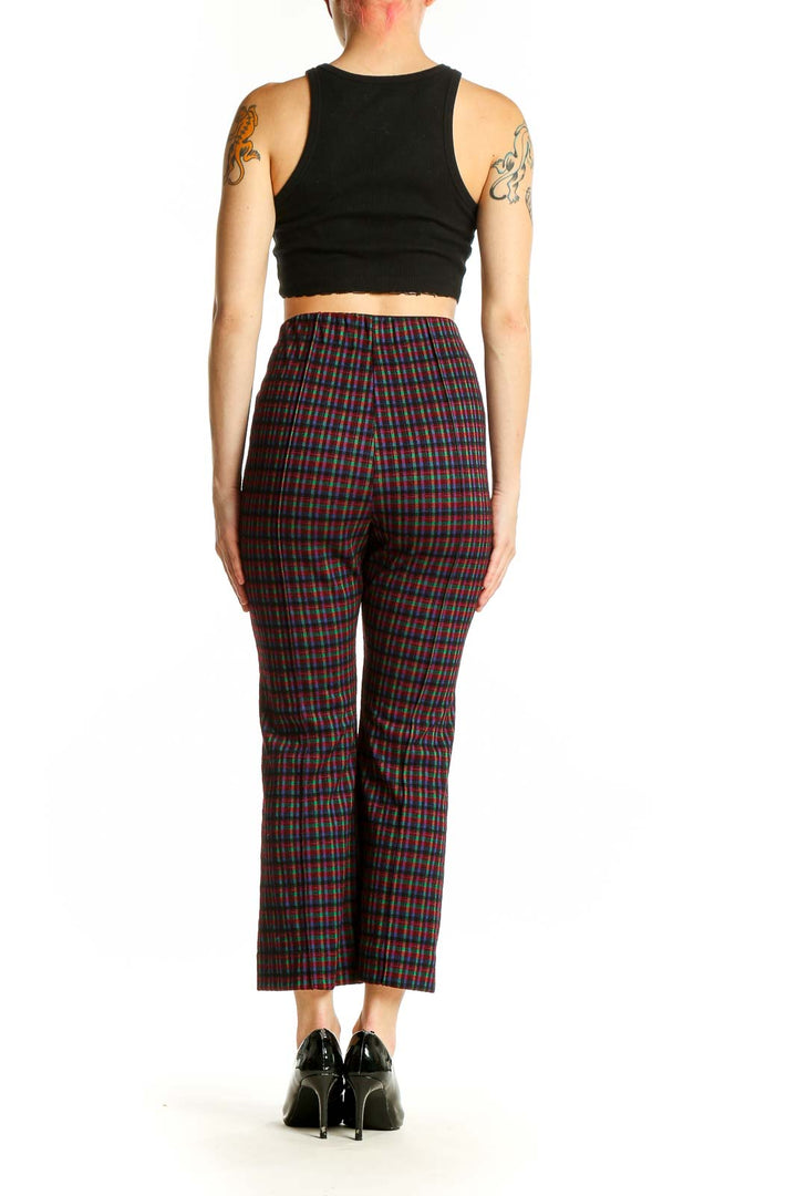 Side view of model wearing Eva Franco multicolor plaid cropped wide-leg pants with black top