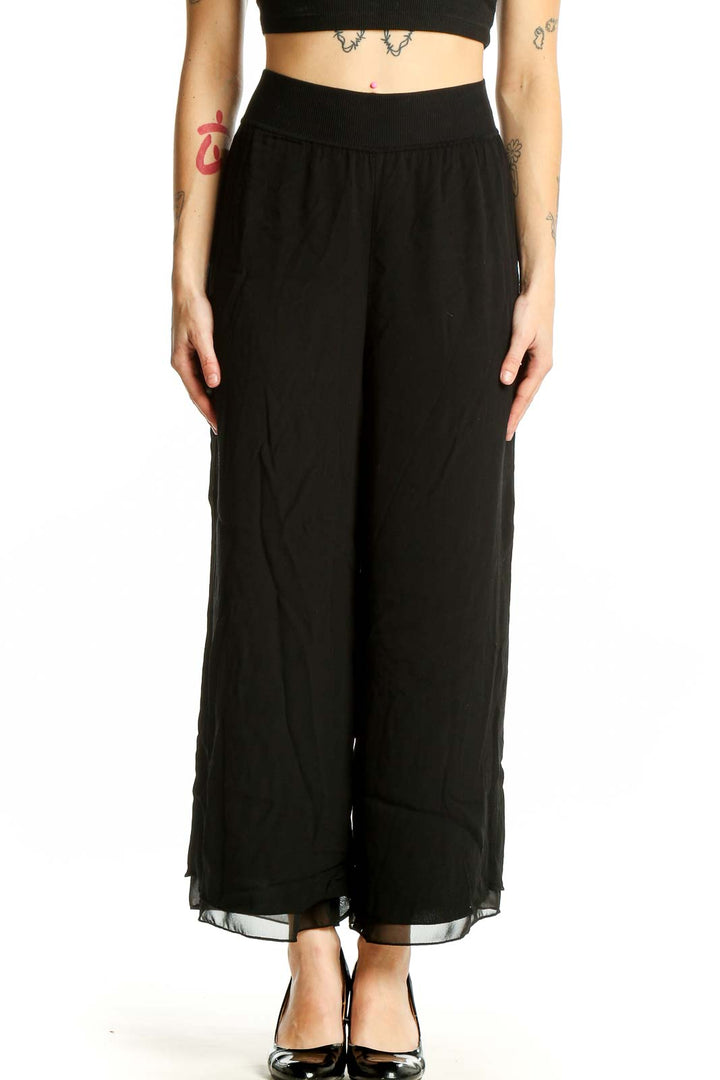 Front view of Theory black wide-leg flowy pants
