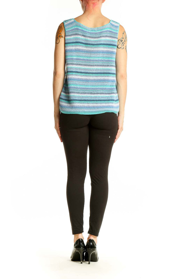 Side view of Sigrid Olsen blue striped knit sleeveless top on model