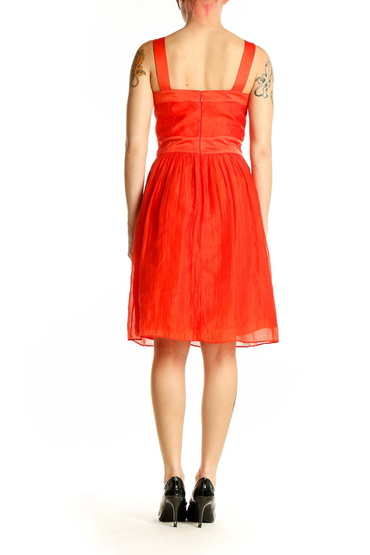 Side view of red Max and Cleo cocktail dress showing flared skirt