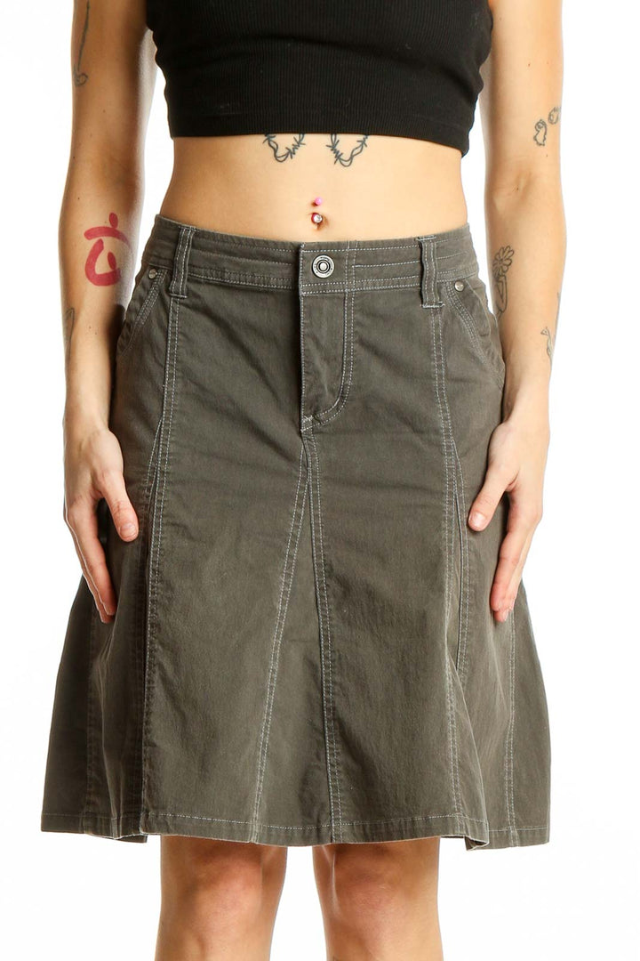 Front view of KUHL olive A-line utility skirt with pockets