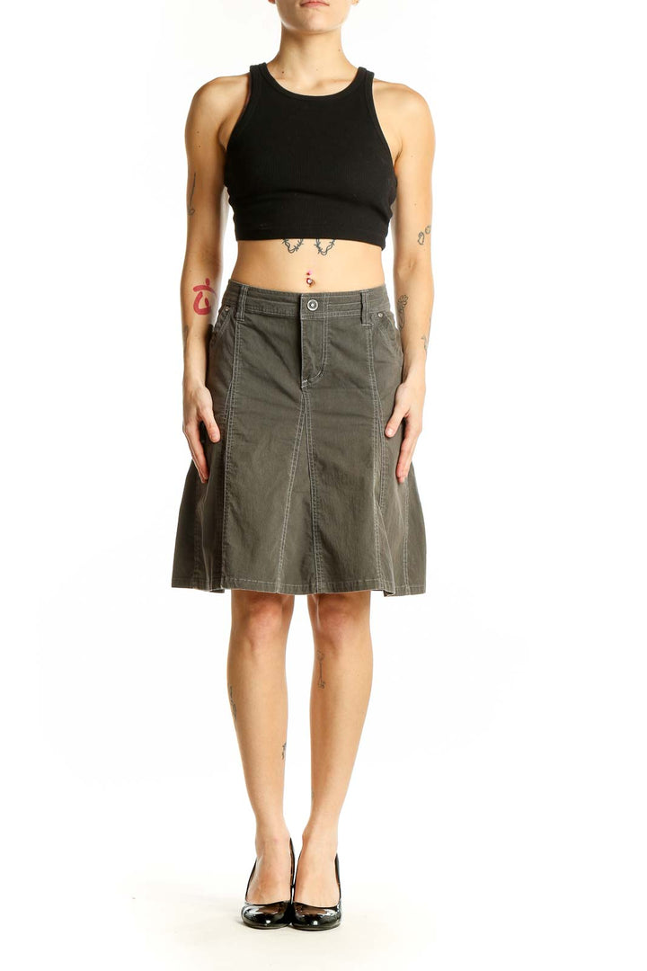 Front view of KUHL olive A-line utility skirt with pockets