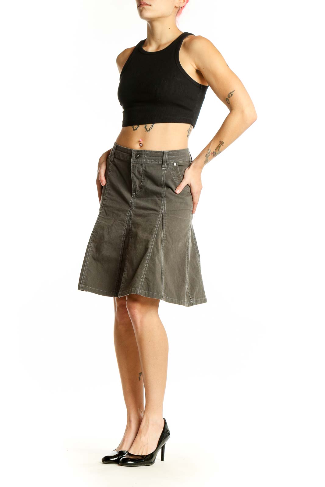 Front view of KUHL olive A-line utility skirt with pockets