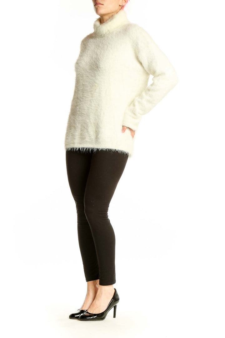 Front view of cream fuzzy turtleneck sweater by Sanctuary
