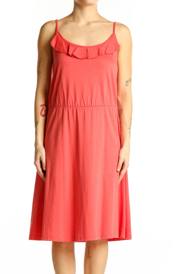 Front view of coral LOFT midi dress with ruffled neckline and spaghetti straps