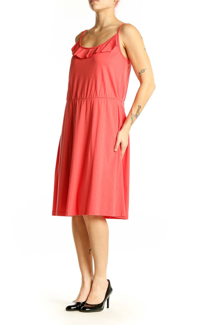 Front view of coral LOFT midi dress with ruffled neckline and spaghetti straps
