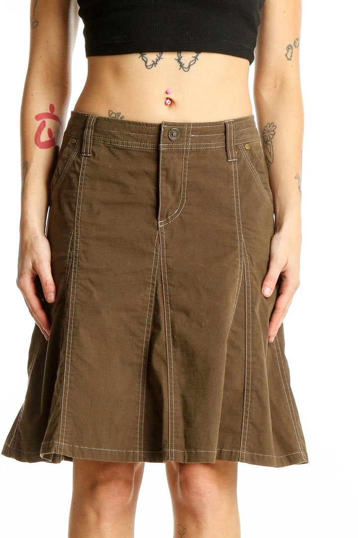 Front view of KUHL brown A-line skirt with contrasting stitching