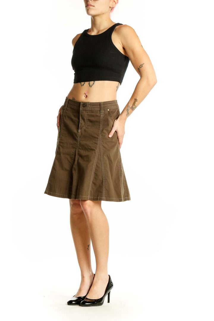 Front view of KUHL brown A-line skirt with contrasting stitching