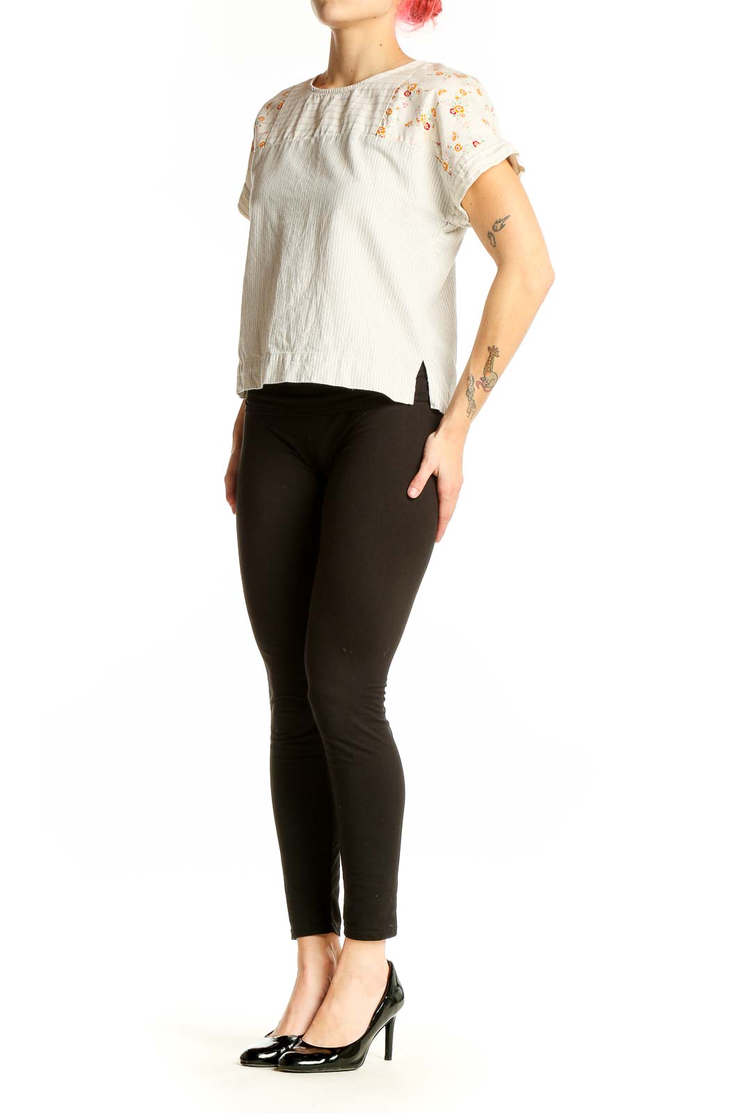 Front view of Madewell white cotton top with orange floral print on shoulders and sleeves