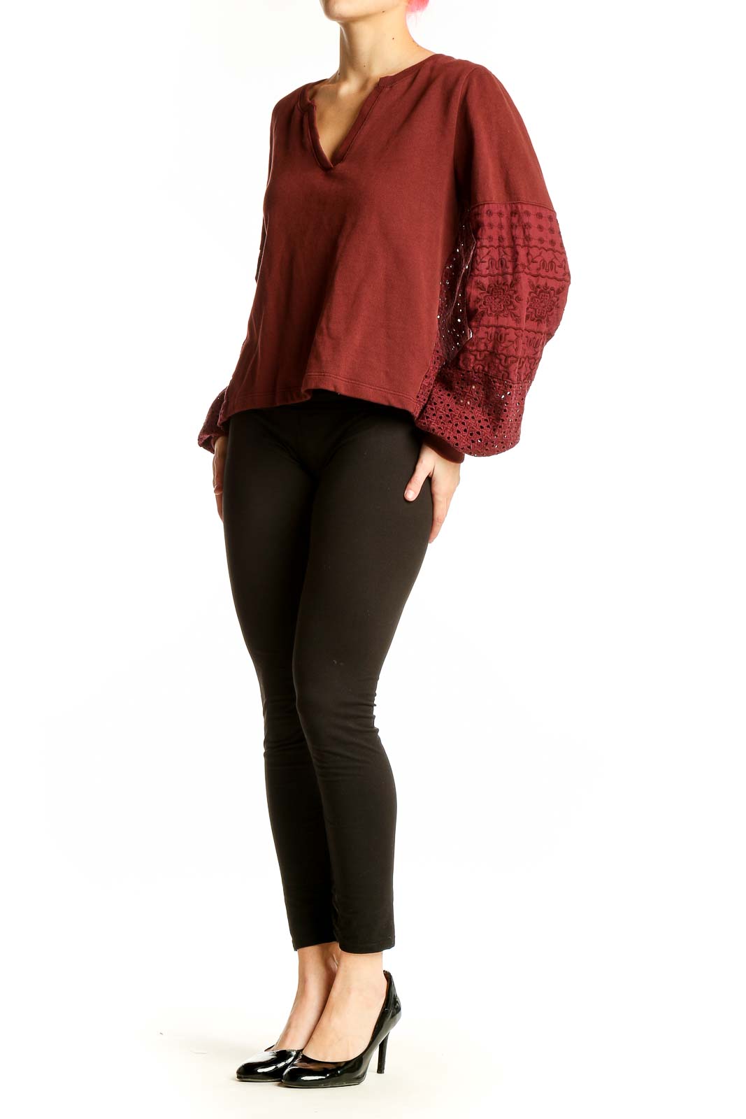 Front view of Anthropologie burgundy knit top with embroidered bell sleeves