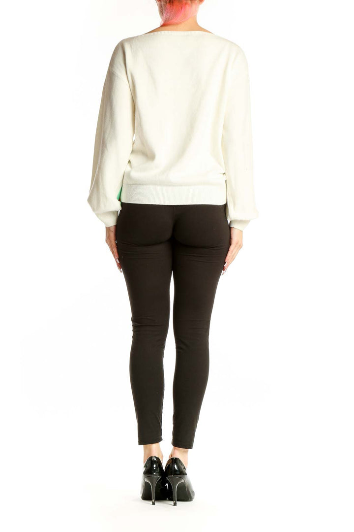 Back view of white ASOS acrylic knit sweater with balloon sleeves