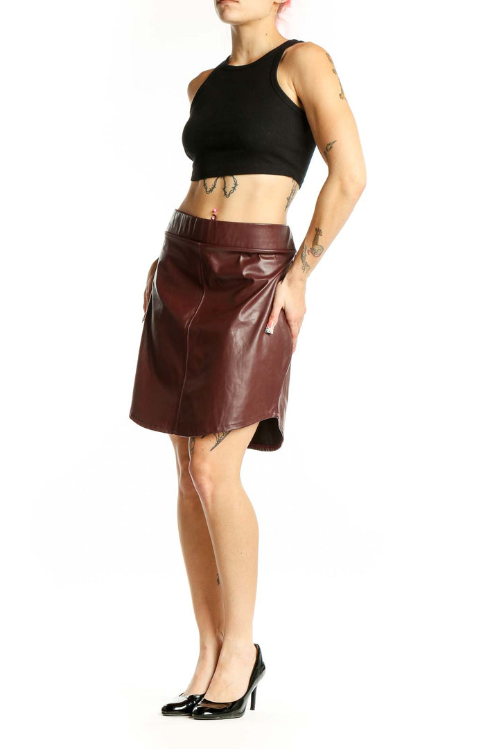 Front view of burgundy faux leather mini skirt from ASOS