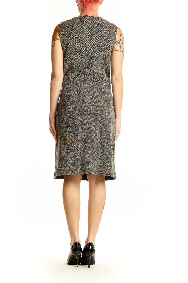Side view of Lands' End gray tweed sleeveless sheath dress showing waist detail and pockets
