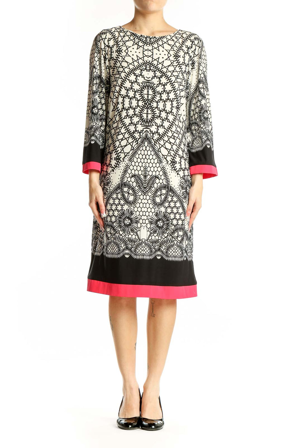 Front view of Eliza J black and white geometric print dress with pink trim