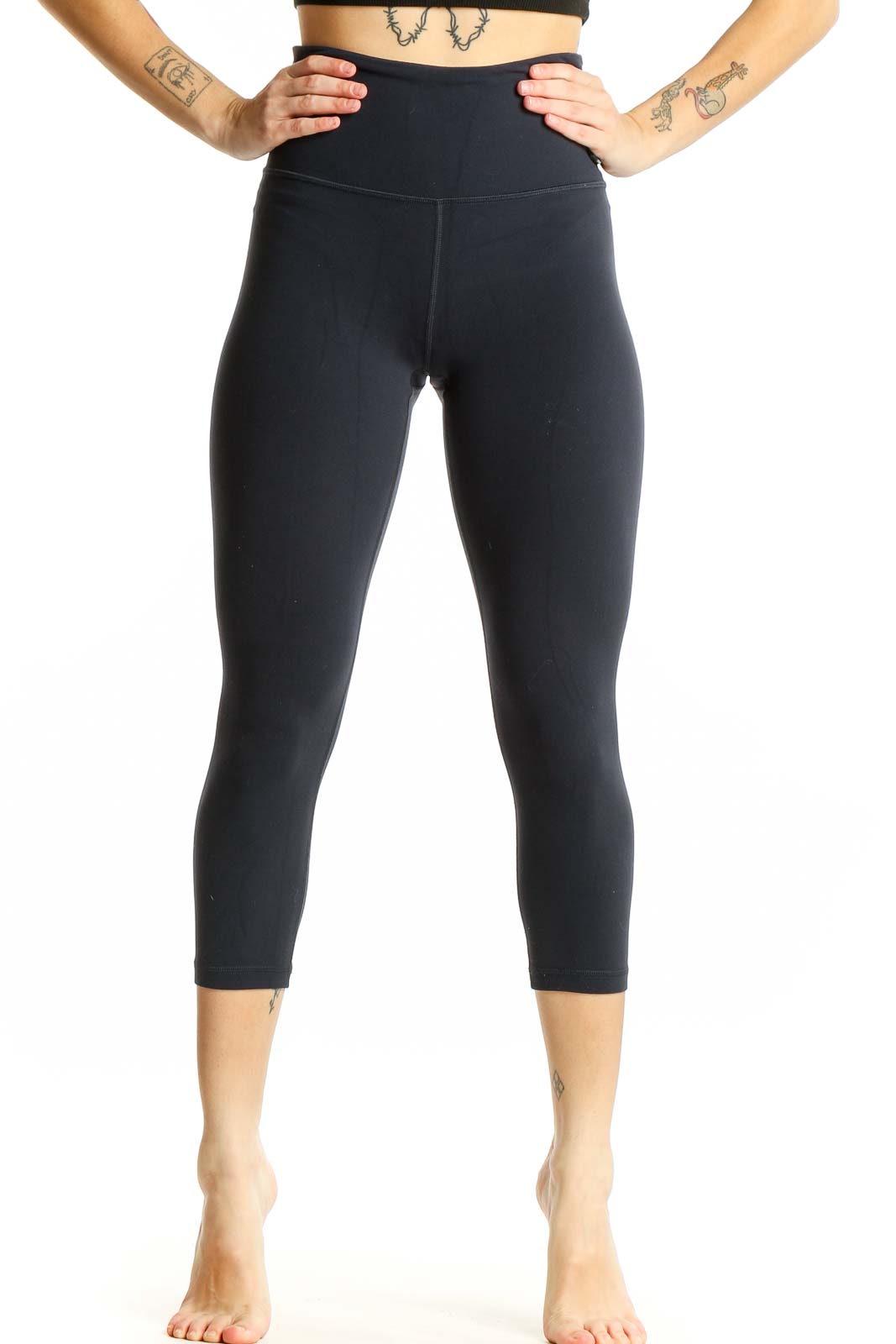 Front view of black Athleta high-waisted capri leggings