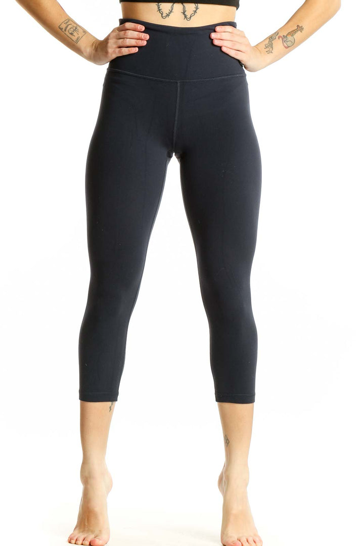 Front view of black Athleta high-waisted capri leggings