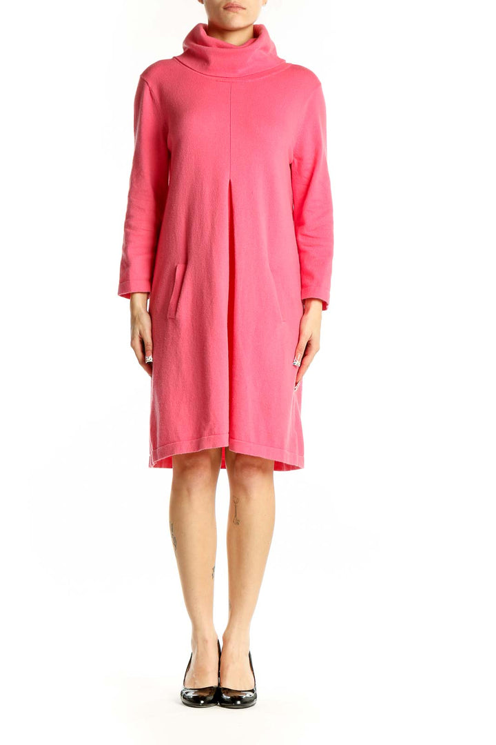 Front view of pink turtleneck sweater dress by Tyler Boe