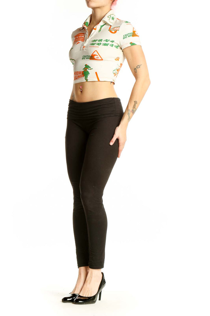 Front view of Urban Outfitters beige crop polo shirt with colorful graphic prints