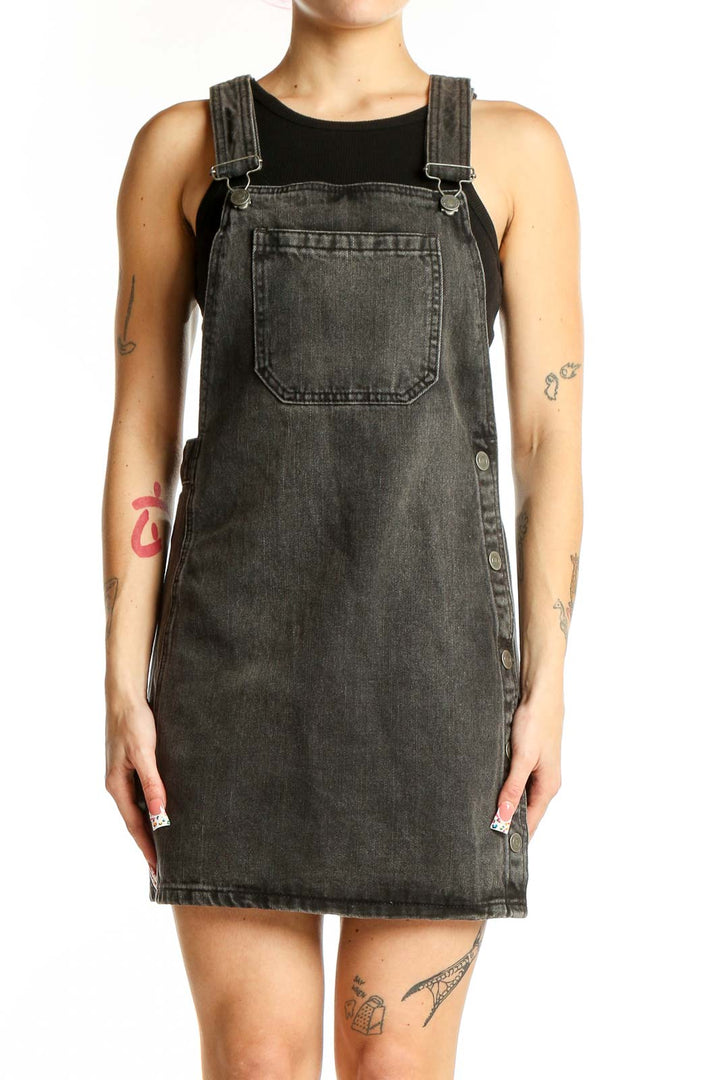 Front view of Free People charcoal denim overall mini dress with bib pocket