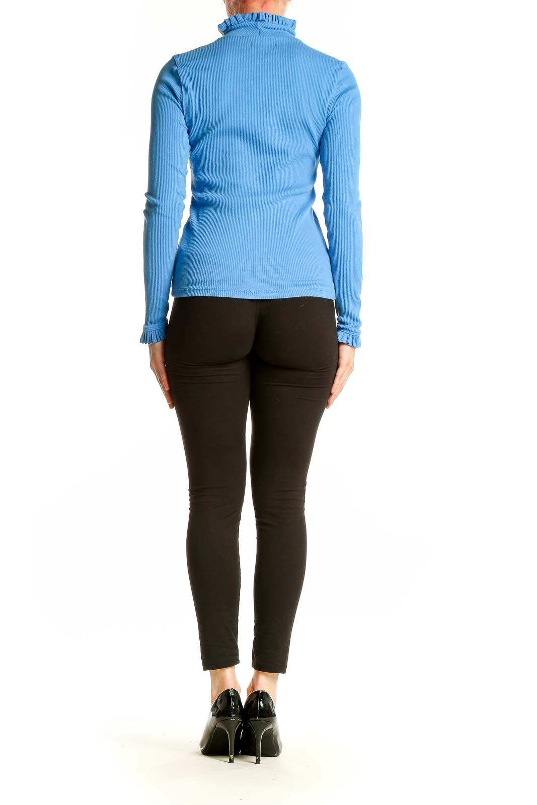 Side view of J.Crew blue ribbed ruffle-neck long sleeve top on model