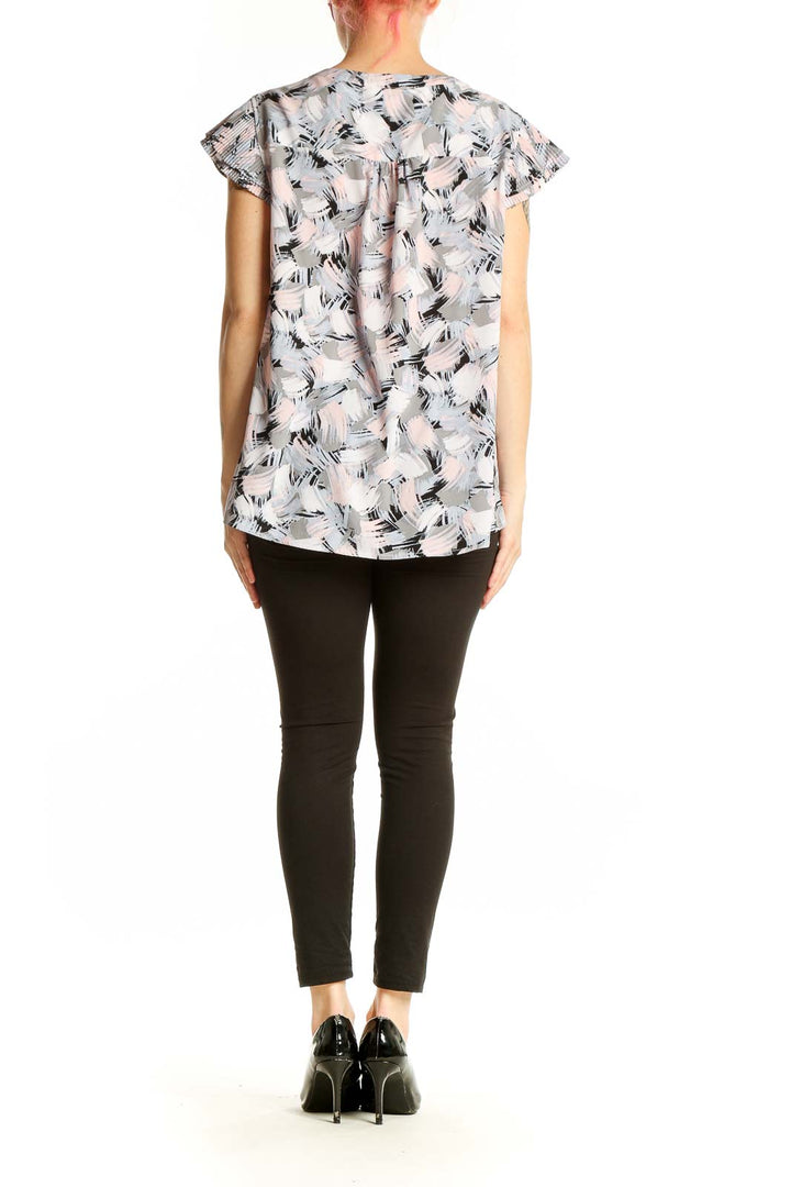 Back view of Calvin Klein gray abstract print cap sleeve blouse on model