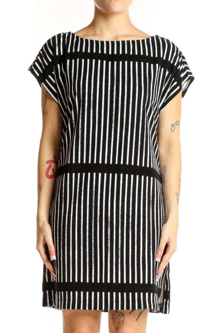 Front view of Marimekko black and white striped dress with boat neckline