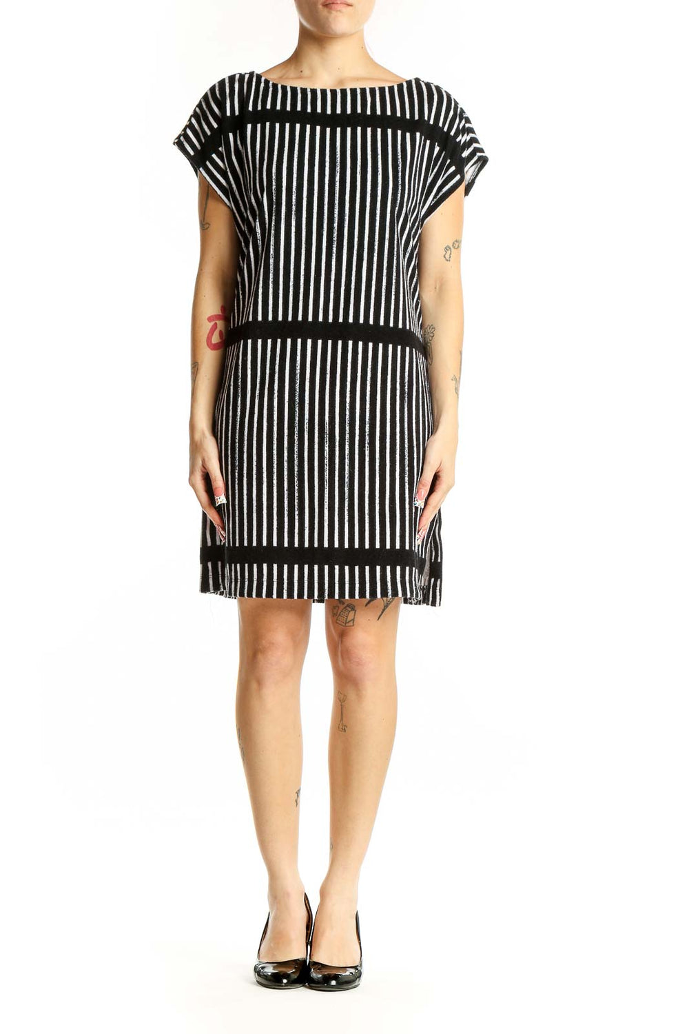 Front view of Marimekko black and white striped dress with boat neckline