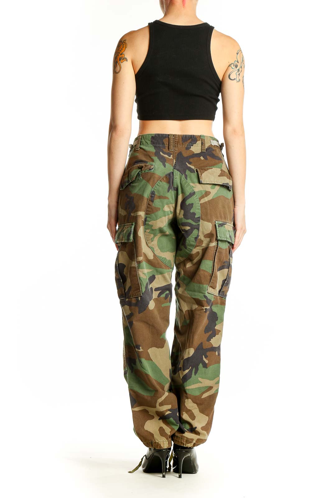 Side view of woman wearing SilkRoll green camouflage cargo pants with black crop top