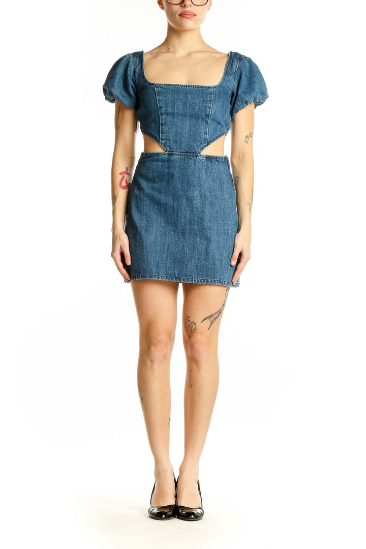 Front view of blue denim mini dress with square neckline and puff sleeves