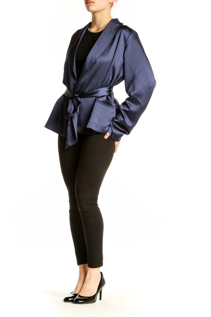 Front view of Carbon 38 navy satin wrap jacket with tie belt