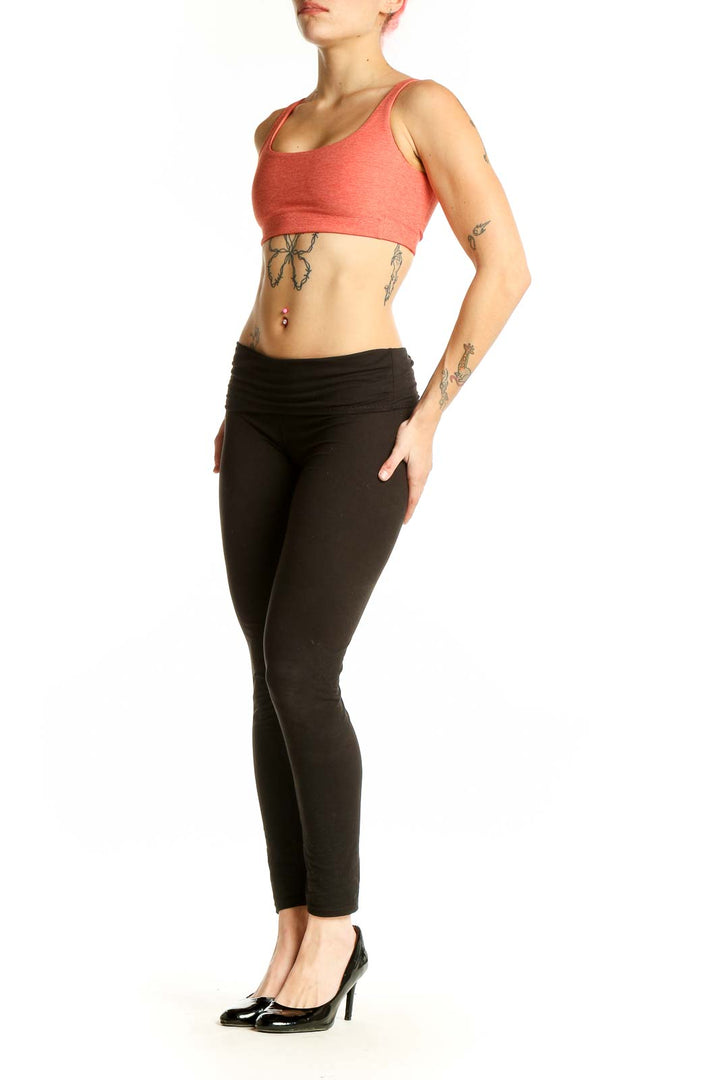 Front view of coral Outdoor Voices racerback sports bra